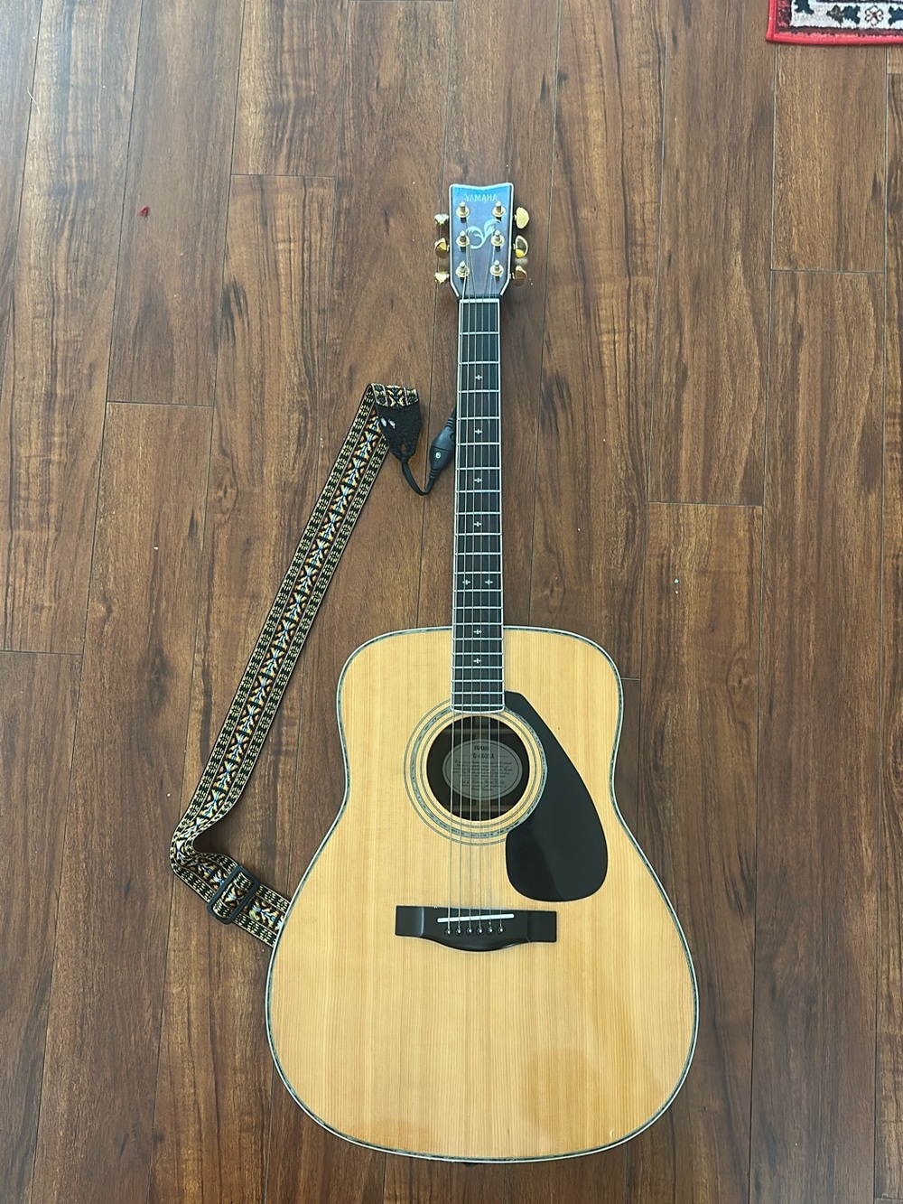 Yamaha Natural Wood Acoustic Guitar with Black Pickguard